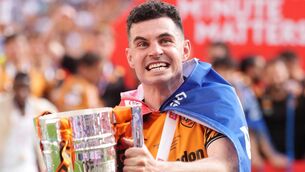 <p>Hull City's John Egan celebrates with the trophy after winning promotion to the Premier League following the Sky Bet Championship play-off final against Middlesbrough at Wembley Stadium, London. Picture: Adam Davy/PA Wire. </p> <p>Hull City's John Egan celebrates with the trophy after winning promotion to the Premier League following the Sky Bet Championship play-off final against Middlesbrough at Wembley Stadium, London. Picture: Adam Davy/PA Wire. </p>