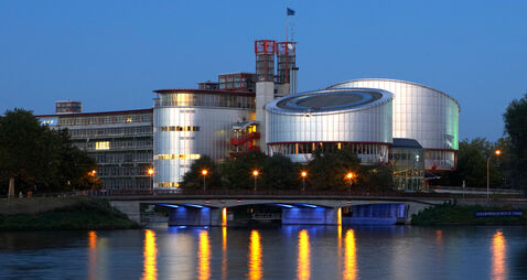 View of the European Court of Justice for human rights with the two cylindrical buildings of the court halls in the evening