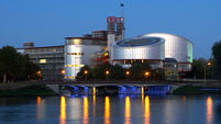 View of the European Court of Justice for human rights with the two cylindrical buildings of the court halls in the evening