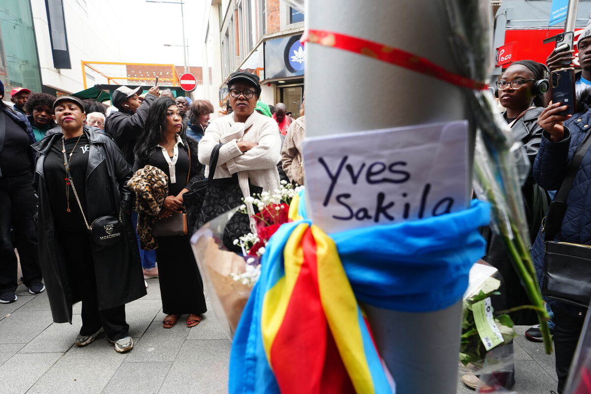 People attend a vigil for Yves Sakila on Henry Street, Dublin. Picture: PA People attend a vigil for Yves Sakila on Henry Street, Dublin. Picture: PA