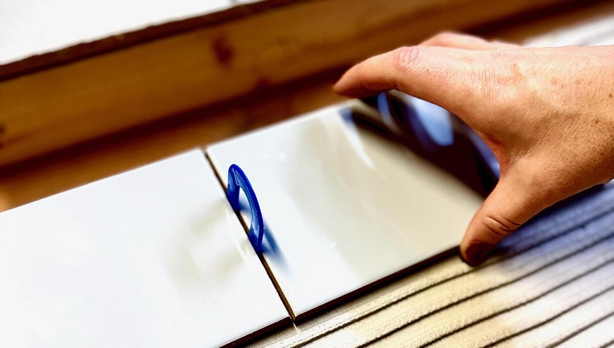 Lay tiles, adjusting carefully as you go. Lay tiles, adjusting carefully as you go.