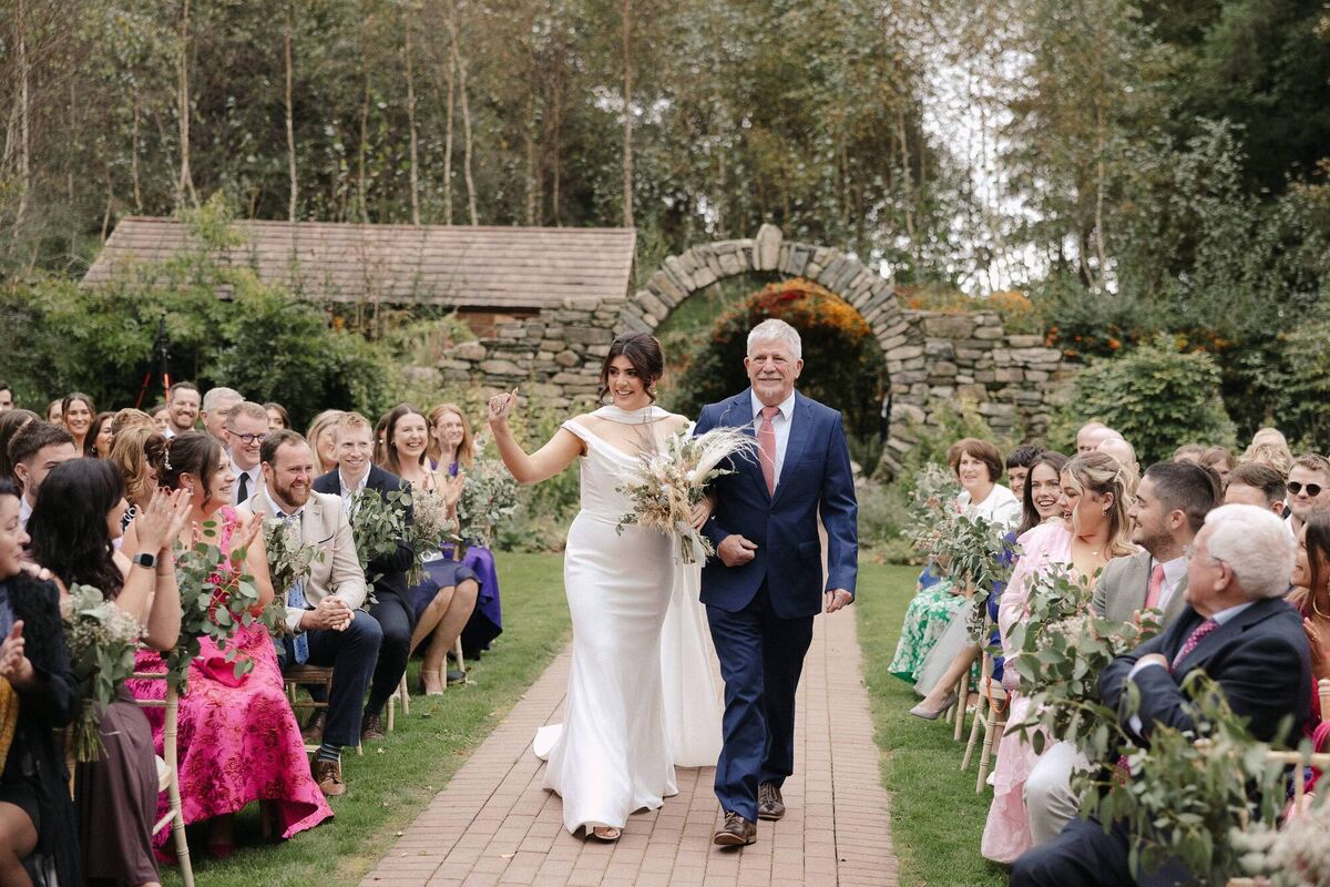 Fionnuala Jay walking down the aisle with her dad. 