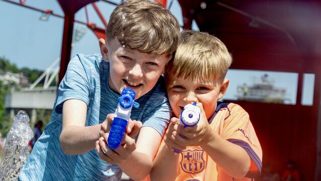<p>Kodi Ahern and Jack Hayes take aim with water pistols as supporters gather in Marina Park before the Cork v Clare senior hurling clash at Páirc Uí Chaoimh. Picture: Chani Anderson</p>