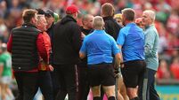 Tempers flare at half time between the backroom staff from both teams as they approach referee Thomas Walsh 7/6/2025