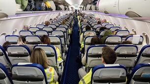 <p>The 'Irish Examiner' was given access last year to a deportation flight to document how they are run [see link below]. This is a different flight to the one described to the PAC, but it illustrates how they are policed, with gardaí occupying aisle and window seats, leaving the middle seats for deportees. Picture: Chani Anderson</p>