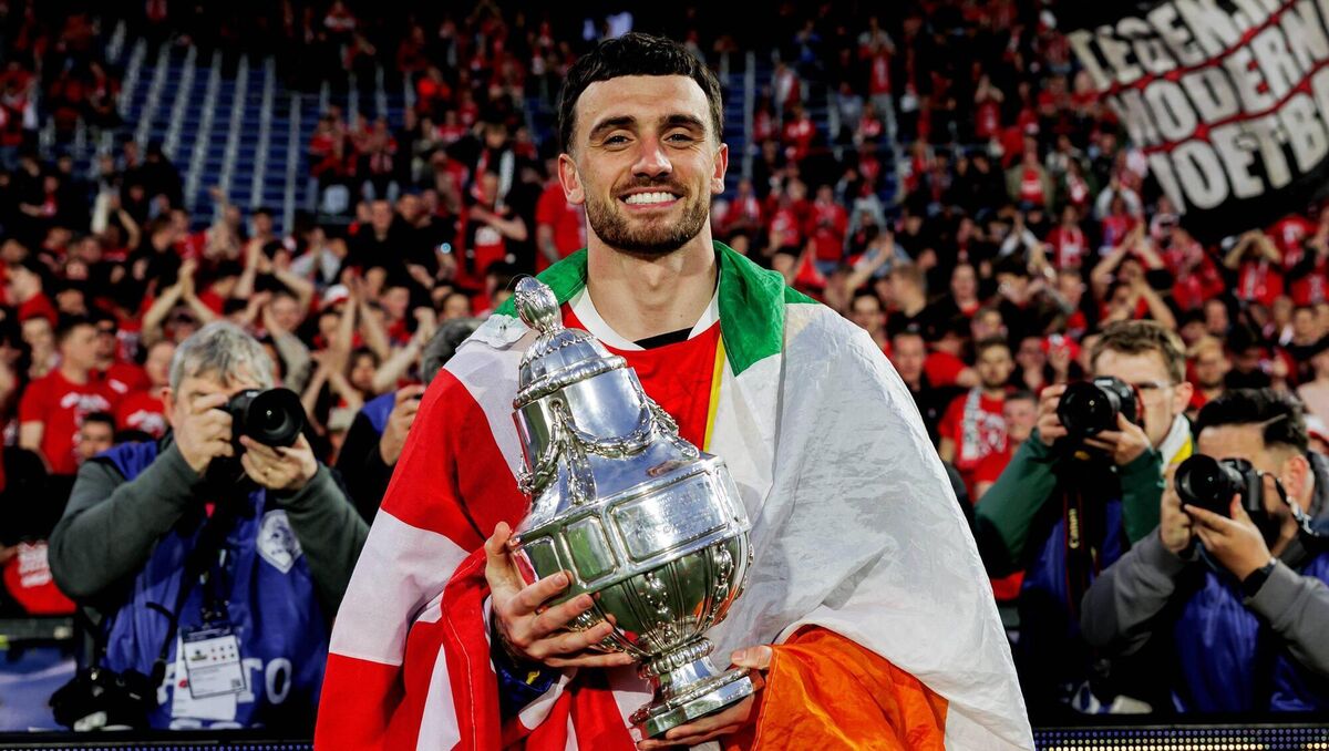 Ireland's Troy Parrott, draped in a tricolour, celeberates AZ Alkmaar's win in the Europjackpot KNVB Beker (Dutch Cup final). Picture: Marcel Bonte/Soccrates/Getty Images Ireland's Troy Parrott, draped in a tricolour, celeberates AZ Alkmaar's win in the Europjackpot KNVB Beker (Dutch Cup final). Picture: Marcel Bonte/Soccrates/Getty Images