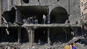 Palestinians inspect the rubble of a building destroyed in an Israeli airstrike in Nuseirat, central Gaza Strip (Abdel Kareem Hana/AP) Palestinians inspect the rubble of a building destroyed in an Israeli airstrike in Nuseirat, central Gaza Strip (Abdel Kareem Hana/AP)
