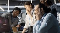 Programmers in data center panicking after viewing malware security breach alert