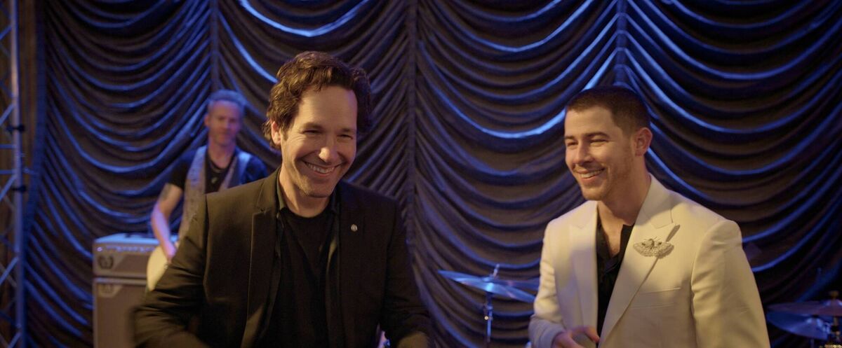 Paul Rudd and Nick Jonas in Power Ballad. Paul Rudd and Nick Jonas in Power Ballad.