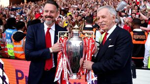 <p>POSITION OF STRENGTH: Josh and Stan Kroenke get their hands on the Premier League trophy at Selhurst Park on Sunday. Picture: Michael Regan/Getty </p> <p>POSITION OF STRENGTH: Josh and Stan Kroenke get their hands on the Premier League trophy at Selhurst Park on Sunday. Picture: Michael Regan/Getty </p>