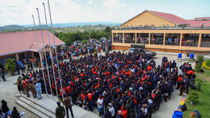 Students gather after a fire at Utumishi Girls School in Gilgil (Andrew Kasuku/AP) Students gather after a fire at Utumishi Girls School in Gilgil (Andrew Kasuku/AP)