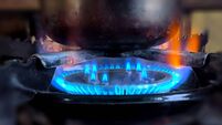 Fire gas flame close-up blurred background, cooking coffee in a cezve on fire