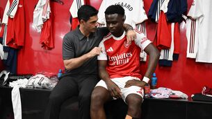 <p>Arsenal manager Mikel Arteta with Bukayo Saka in the dressing room after the Premier League win over Crystal Palace. Photo by Stuart MacFarlane/Arsenal FC via Getty Images</p>