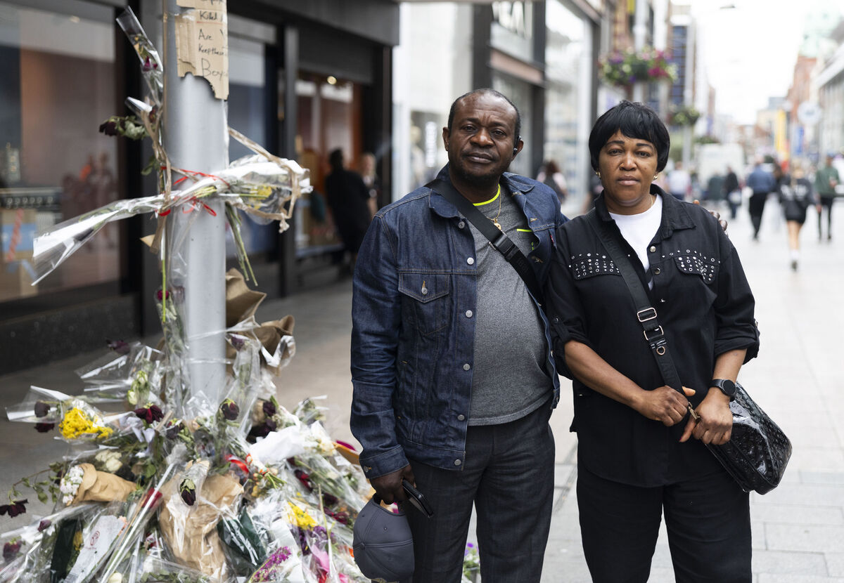 Yves Sakila's uncle Jean Claude (left) and step mother Angel Issemezey Anzibistep (right) at the memorial where he was restrained and later died. Photo: Sam Boal/Collins Photos