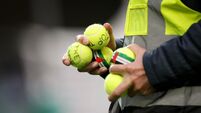 A view of tennis balls thrown on the pitch in protest by fans 28/5/2026