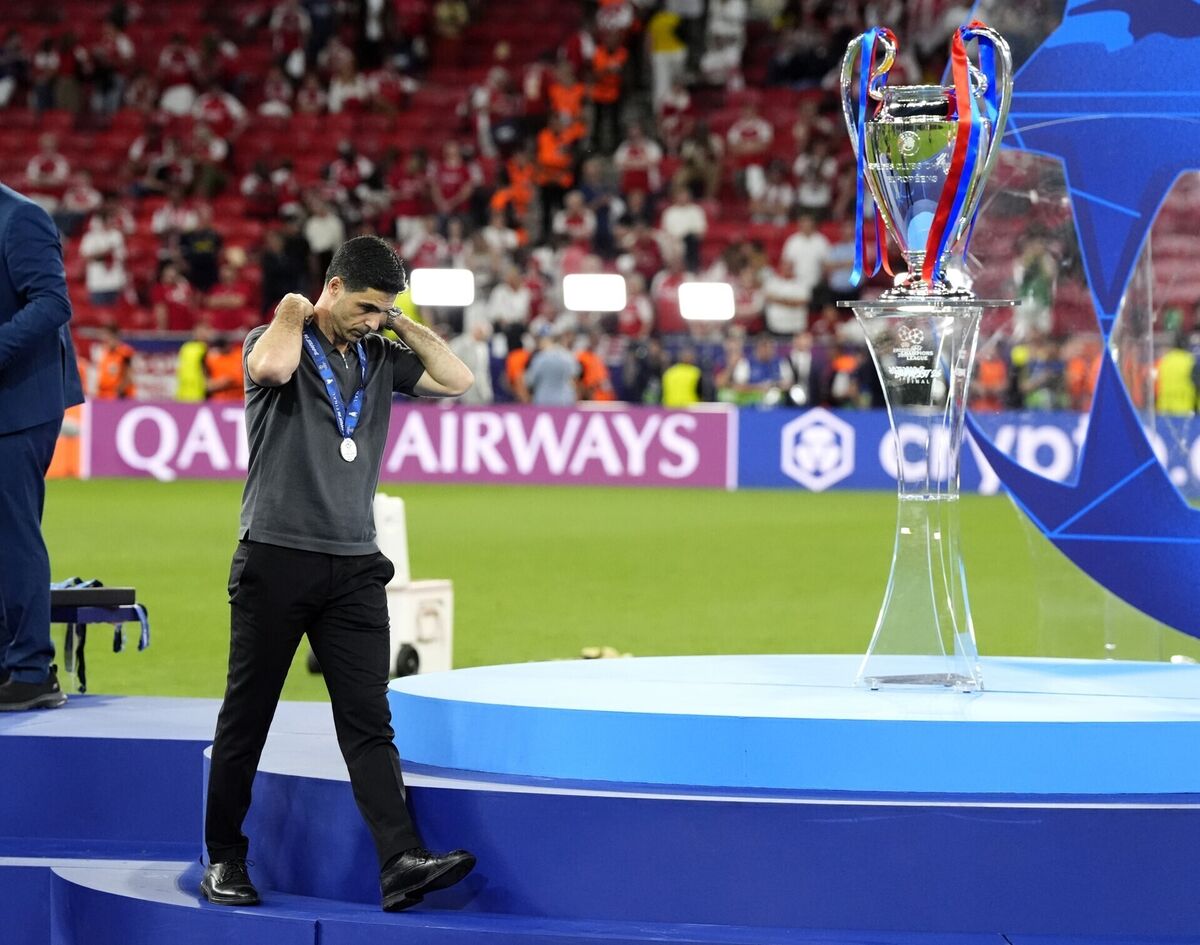Arsenal manager Mikel Arteta walks past the trophy following defeat to Paris Saint-Germain in the Champions League final. Pic: Nick Potts/PA Wire.