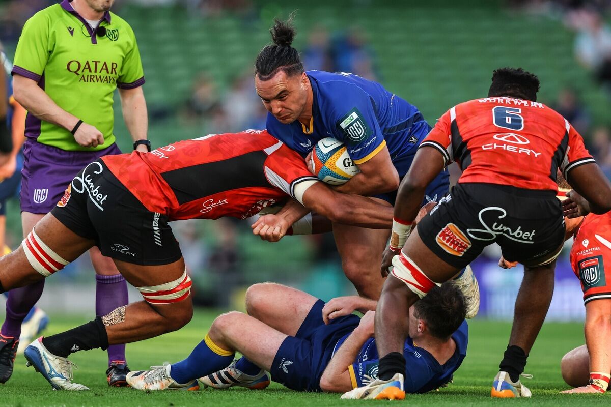 Leinster's James Lowe is tackled by Lions' Darrien Landsberg. Pic: ©INPHO/Ben Brady