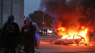 A car burns as PSG supporters celebrate in Paris, Saturday, May 30, 2026 after the Champions League final soccer match between Paris Saint-Germain and Arsenal that’s being played in Budapest., PSG won the game. (AP Photo/Thomas Padilla)