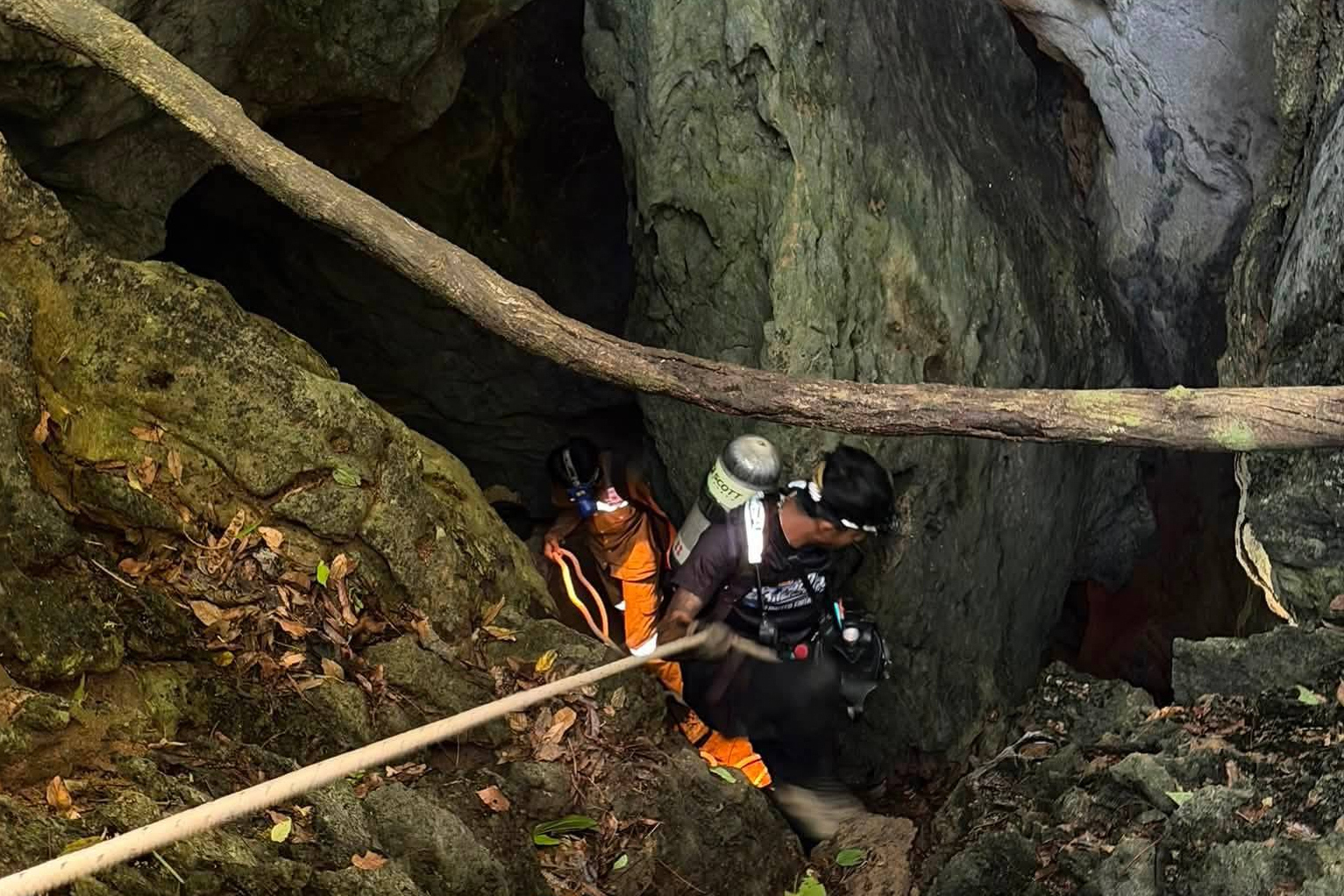 Heavy rains threaten to delay search for last two missing in Laos cave
