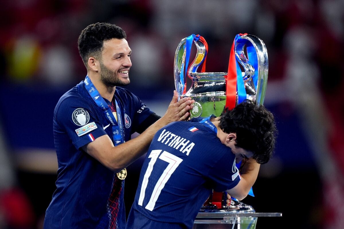 Paris Saint-Germain's Goncalo Ramos (left) and Paris Saint-Germain's Vitinha (right) celebrate with the Champions League trophy following the UEFA Champions League Final at the Puskas Arena, Budapest. Picture: Mike Egerton/PA Wire. Paris Saint-Germain's Goncalo Ramos (left) and Paris Saint-Germain's Vitinha (right) celebrate with the Champions League trophy following the UEFA Champions League Final at the Puskas Arena, Budapest. Picture: Mike Egerton/PA Wire.