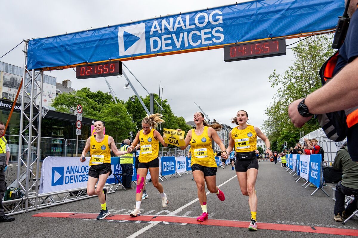Friends and supporters of Ellen Cassidy celebrate as they cross the finish line. Picture Chani Anderson