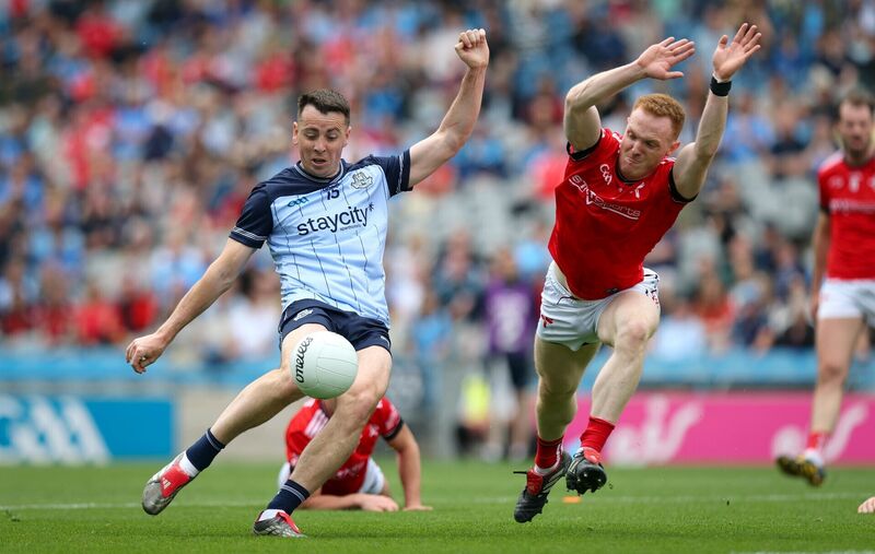 Louth's Donal McKenny dives to block a shot by Dublin's Cormac Costello. Pic: ©INPHO/Ryan Byrne