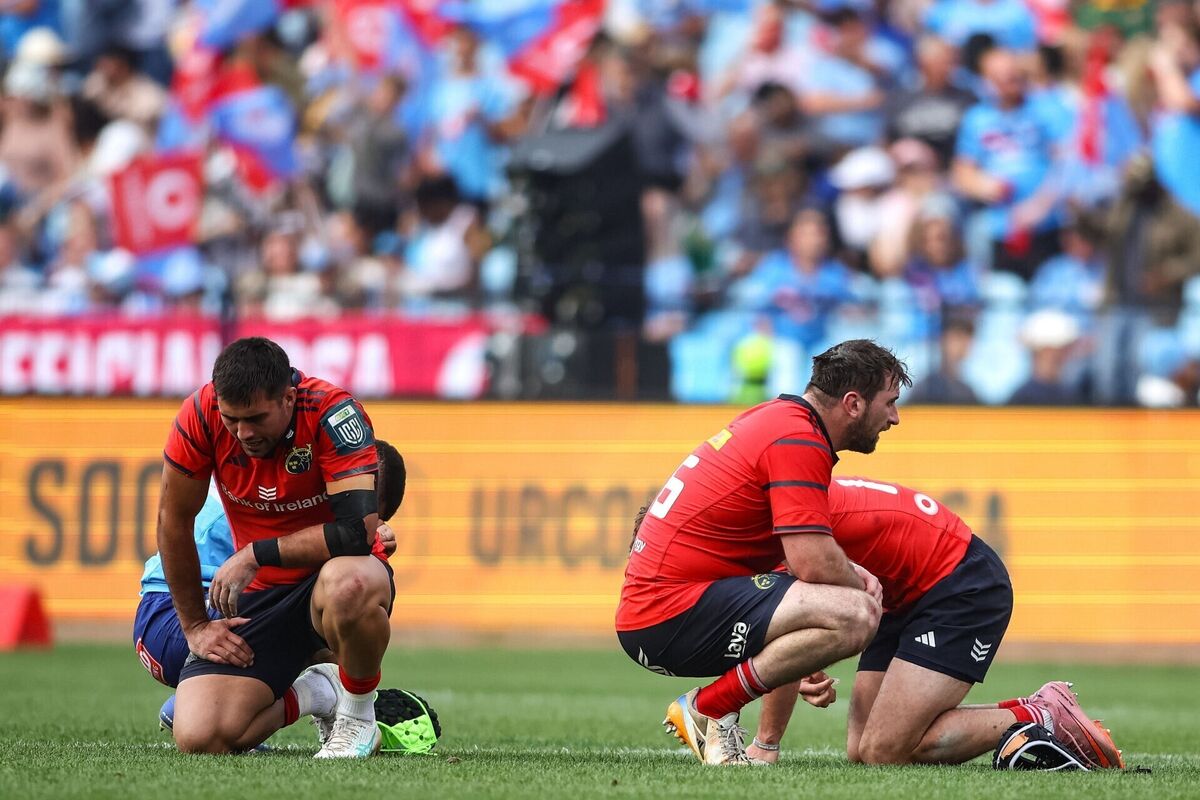 Munster players dejected and exhausted after the final whistle against the Bulls. Pic: Shaun Roy/Sportsfile