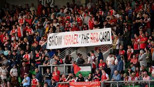<p>St Patrick's Athletic supporters hold up a 'Show Israel The Red Card' banner on Friday during their SSE Airtricity Men’s Premier Division match against Shamrock Rovers at Tallaght Stadium in Dublin. Picture: Stephen McCarthy/Sportsfile</p> <p>St Patrick's Athletic supporters hold up a 'Show Israel The Red Card' banner on Friday during their SSE Airtricity Men’s Premier Division match against Shamrock Rovers at Tallaght Stadium in Dublin. Picture: Stephen McCarthy/Sportsfile</p>