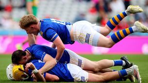 <p>Longford’s Martin Farrell celebrates at the final whistle with Johnny Casey, Reuben Murray and Ronan Courtney. Pic: ©INPHO/Ryan Byrne</p>