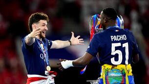 <p>TEAM OF THE YEAR: Paris St Germain's Khvicha Kvaratskhelia and Willian Pacho celebrate next to the Champions League trophy. Pic: Mike Egerton/PA Wire.</p>