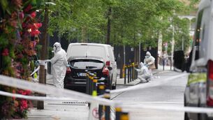 <p>Garda forensic officers at the scene of the stabbing. Picture: Niall Carson/PA Wire</p> <p>Garda forensic officers at the scene of the stabbing. Picture: Niall Carson/PA Wire</p>