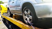 iStock-1073572764.jpg Car being attached to tow truck