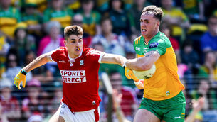 <p>Cork's Ian Maguire and Jason McGee of Donegal</p> <p>Cork's Ian Maguire and Jason McGee of Donegal</p>