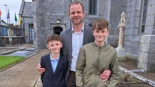 <p>Craig Coady with his sons Paudie and Rory.</p>