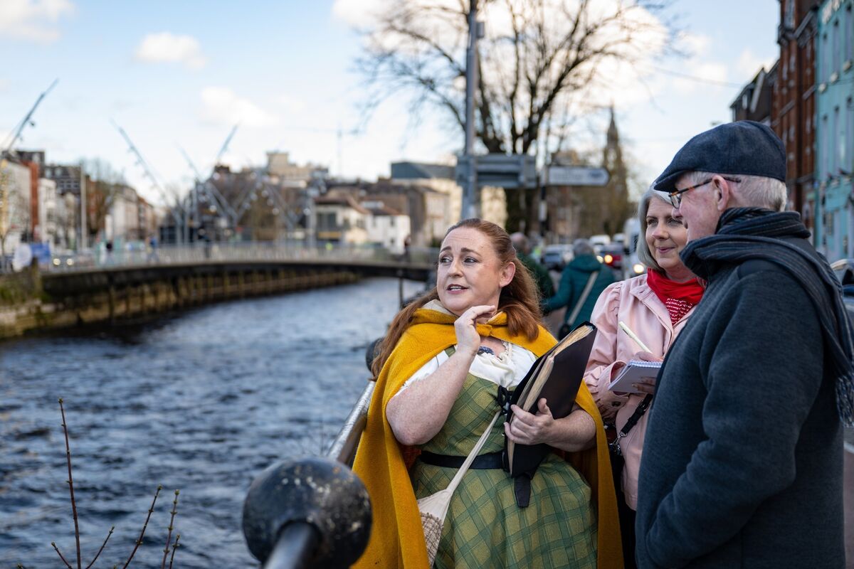 The waterways of Cork provide a backdrop as Angela Newman, creator of Hysterical Histories Cork, regales Irish Examiner Features writer Deirdre McArdle and her father Austin Murphy with medieval tales of milkmaids and heads on spikes during a walking tour through the city. Picture: Chani Anderson
