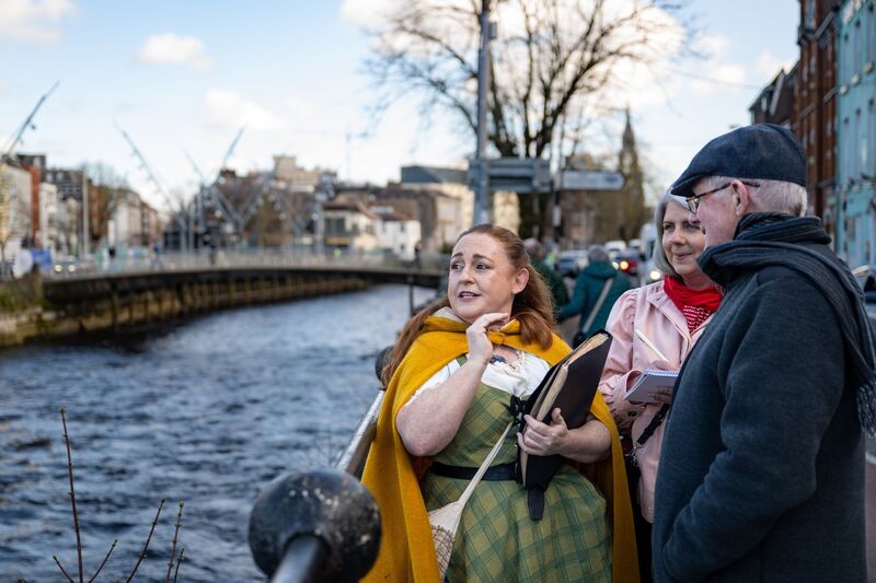The waterways of Cork provide a backdrop as Angela Newman, creator of Hysterical Histories Cork, regales Irish Examiner Features writer Deirdre McArdle and her father Austin Murphy with medieval tales of milkmaids and heads on spikes during a walking tour through the city. Picture: Chani Anderson