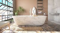 Cozy Pastel Colored Bathroom with Marble Bathtub