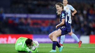 <p>Nicky Evrard of Belgium claims the ball whilst under pressure from Christy Grimshaw of Scotland. Pic: Ian MacNicol/Getty Images</p>