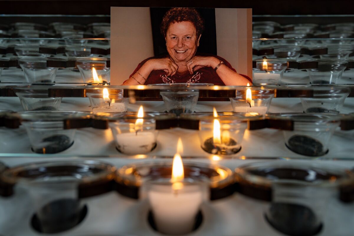 A photograph of the late Kathleen O’Sullivan surrounded by candles inside the Cathedral of St Mary and St Anne. 