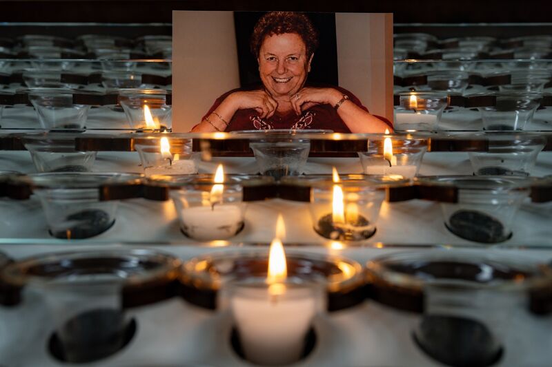 A photograph of the late Kathleen O’Sullivan surrounded by candles inside the Cathedral of St Mary and St Anne. 