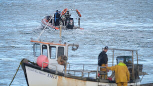 <p>The search for a missing person took place after a boat sank in Carlingford Lough (Niall Carson/PA)</p>