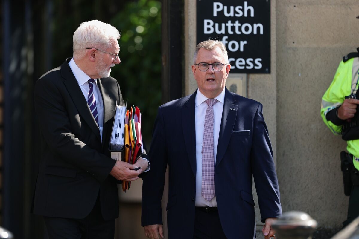 Jeffrey Donaldson (right) accompanied by his solicitor John McBurney, leaves Newry Crown Court, where he and his wife Eleanor Donaldson are accused of historical sexual offences. Picture: Liam McBurney/PA Wire