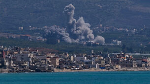 <p>Smoke rises from an Israeli airstrike that hit Qlaileh village in Lebanon on Tuesday (Mohammed Zaatari/AP)</p>