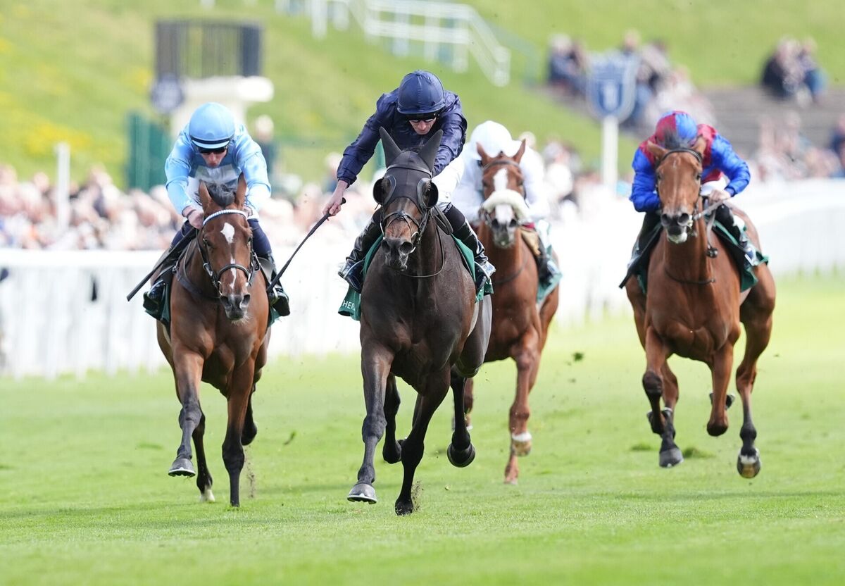 OUT IN FRONT: Amelia Earhart ridden by Ryan Moore on their way to winning the Weatherbys Cheshire Oaks on Trials Day of the Boodles May Festival at Chester Racecourse. Picture: Martin Rickett/PA