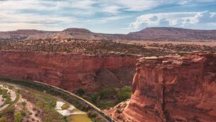 <p>Canyon Spirit carving its way through the dramatic red rock route</p>
