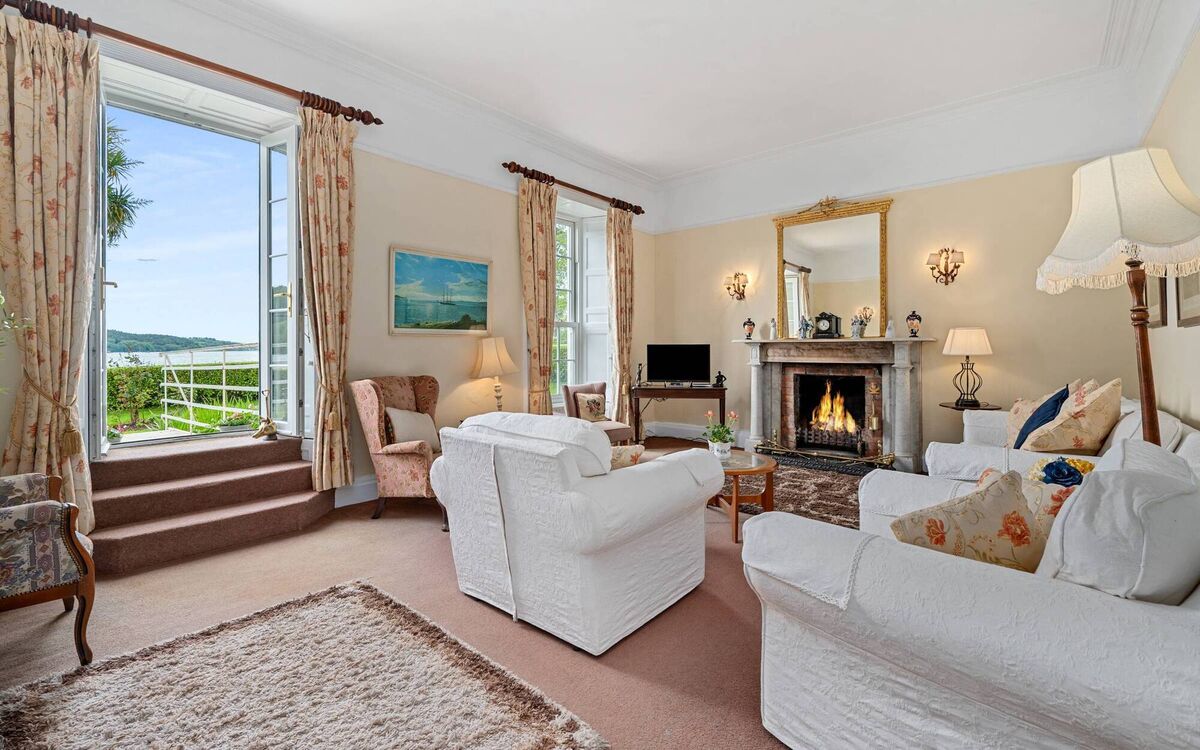 Elegant drawing room with French doors to walkway