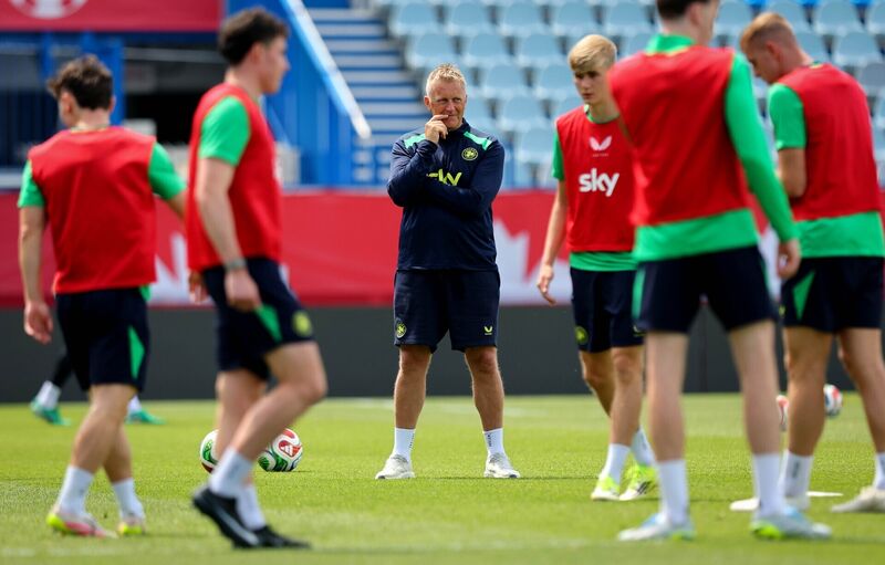 Hallgrímsson watches on as his players prepare for their match with World Cup co-hosts Canada. Picture: Ryan Byrne/Inpho