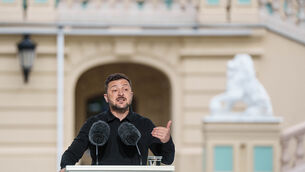 Ukraine’s President Volodymyr Zelensky speaks to journalists during a joint press conference with Nato in Kyiv (Evgeniy Maloletka/AP)