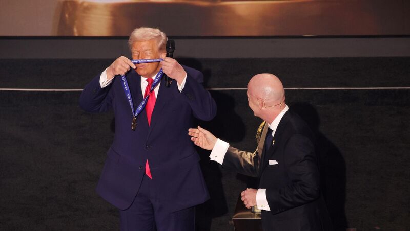 US President Donald Trump is presented with the inaugural FIFA Peace Prize award by FIFA President Gianni Infantino during the 2026 FIFA World Cup draw last December. Photo: Sam Corum/PA