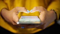 Woman Typing Phone Message On Social Network At Night